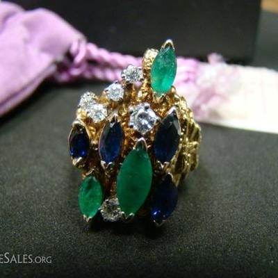 Ladies custom made 18 kt. yellow gold dress ring.  Contains (1) Marquise cut emerald .73 ct, (2) Marquise cut emeralds .57 ct each, (2)...