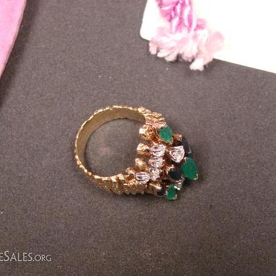 Ladies custom made 18 kt. yellow gold dress ring.  Contains (1) Marquise cut emerald .73 ct, (2) Marquise cut emeralds .57 ct each, (2)...