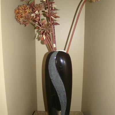 black vase with stems 