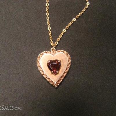 Ladies heart shaped locket.  Heart shaped Amethyst center stone.  Back of locket is engraved, 