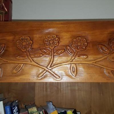 floral accents on bookshelf