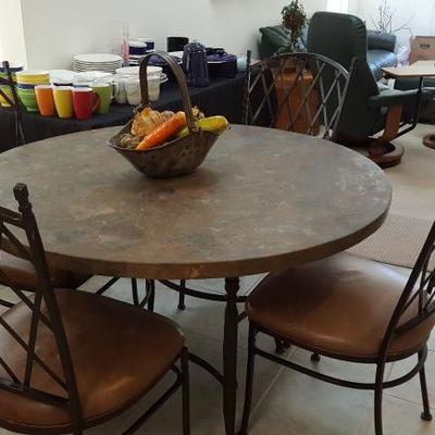 designer circular stone topped table with (4) metal and leather chairs.