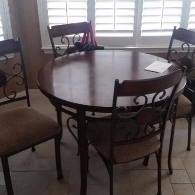 Small round dining table with 4 chairs