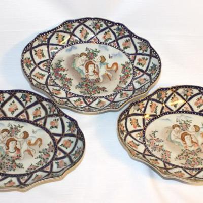 Set of three hand painted decorative platters