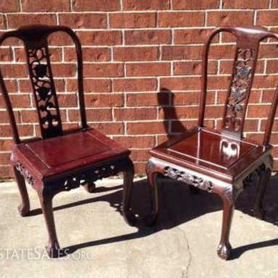 Two Rosewood side chairs with grape carved design