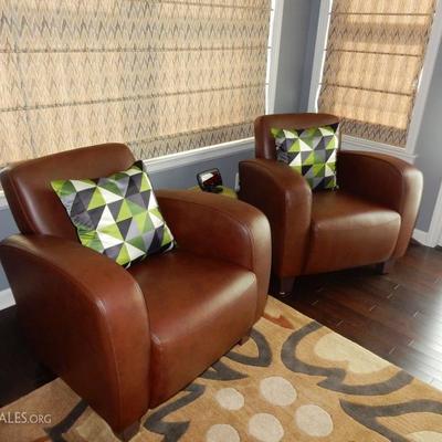 Matching pair of leather pub style chairs