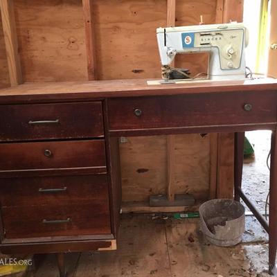 vintage singer sewing machine in cabinet