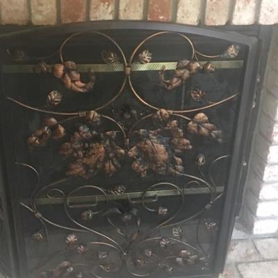 Metal fireplace cover with decor