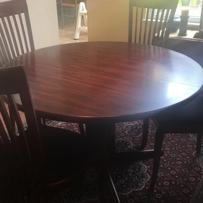 Dining table with long slat chairs