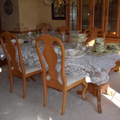 Light oak dining room table with 6 chairs and matching hutch