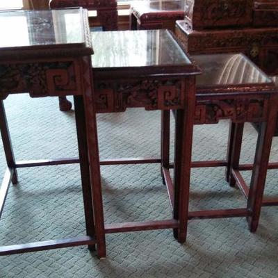 Set of 4 hand carved antique nesting tables.
