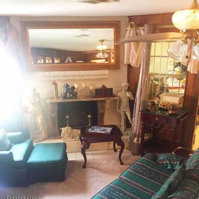 Sofa, arm chair with ottoman, side table, large mirror, statue of David, statue of Venus, desk, decorative items, candles, frames