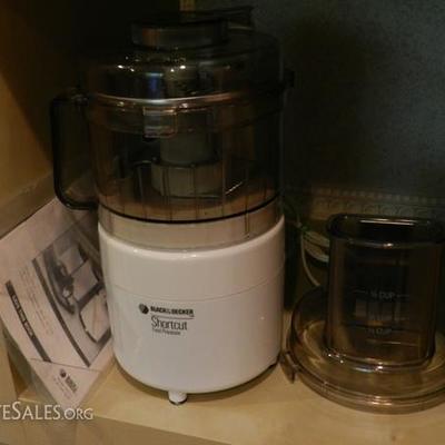 compact Cuisinart food processor with accessories