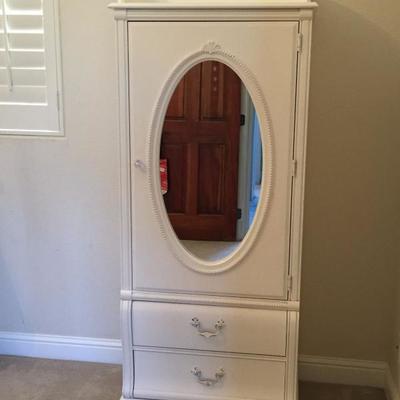 White wardrobe with oval mirror