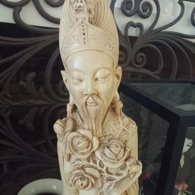 Ivory colored resin hand carved statue