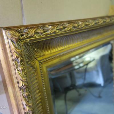 Detail, large gilt mirror