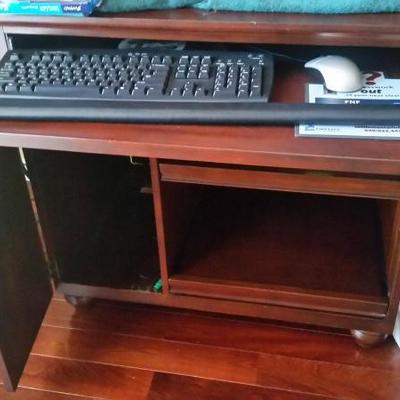 Wood computer desk with slide out keyboard tray.  This item is priced at $50.00
