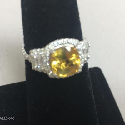 18kt White gold Diamond and yellow Sapphire ring.