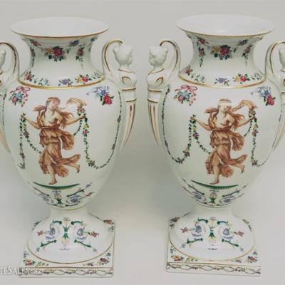 Lot 203 - A matched pair of Designer 20th c. Porcelain Grecian Style Urns with Maiden Handles. Decorated with semi nude women and floral...