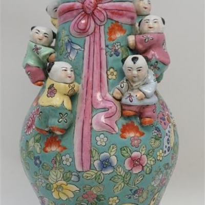 Lot 194 - Chinese 20th c. Export Enameled Porcelain Climbing Children Vase. With typical apocryphal mark for Da Qing Qianlong Nian Zhi...