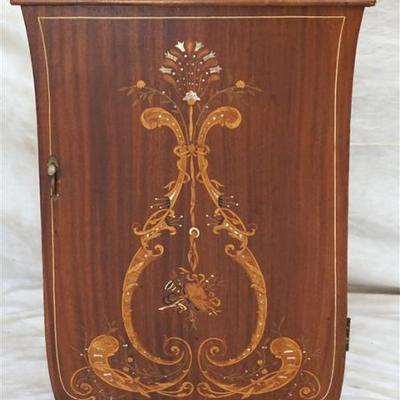 Lot 43- Antique Marquetry Inlaid Music Cabinet. Shaped mahogany case, marquetry inlaid front door with foliate scroll, musical...