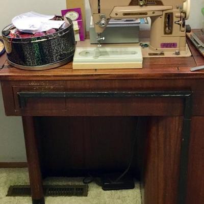 Vintage Singer sewing machine and extensive sewing tools and accessories (buttons, thread, seaming, etc.) as well as hobby/craft items 