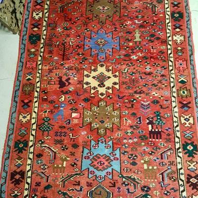 Persian rug with figures and animal motifs