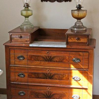 antique chest of drawers with marble insert & flame mahogany detail & glove boxes, glass oil lamps