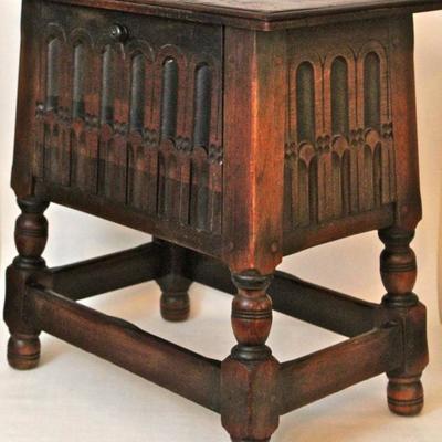 carved wood storage box with on legs with drop front compartment