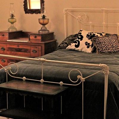 painted antique iron bed, chest of drawers with marble insert, side table, carved wood frame mirror