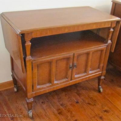 rolling bar-serving cart with drop leaves, storage shelf, and lower cabinet