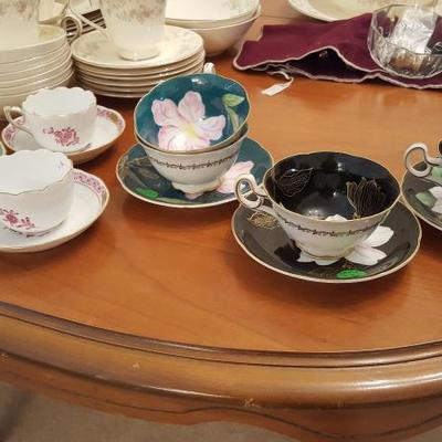 Variety of teacups and saucers