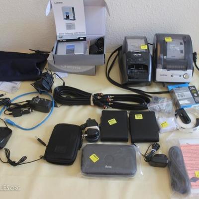 Box lot of electronical components, two Brother  label printers, two Linksys voice gateways with  router new in box, two HP ipaq travel...