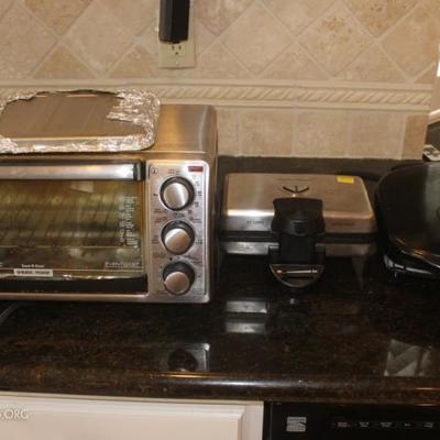 Three countertop appliances, toaster oven, waffle  maker, grill by George Foreman
