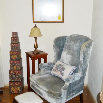 wingback chair, table with lamp, stacking boxes, foot stool, etc.