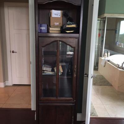 bookcase with glass doors in center