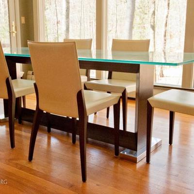 Glass top dining table, with wood and metal base. Table measures 94.5
