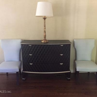 There are two of these designer chests, black quilted fronts.