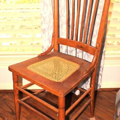 antique chair with cane seat
