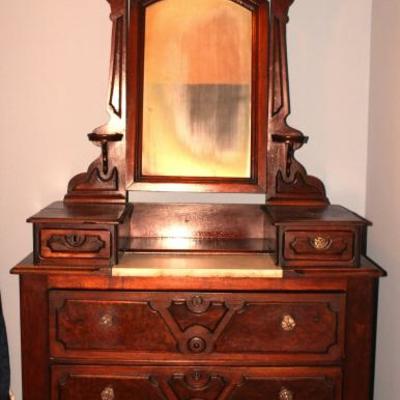 antique Victorian chest of drawers with marble top vanity and pivoting mirror
