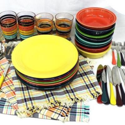 Fiesta plates and cups with place mats and silverware
