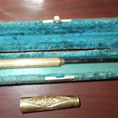 Antique gold cigarette and cigar holders