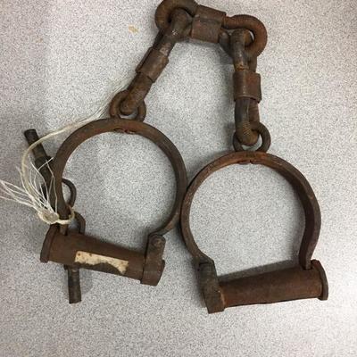 Old metal handcuffs with key