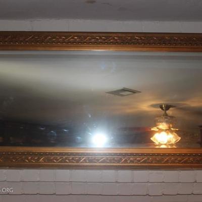 Large mirror with gold tone frame
