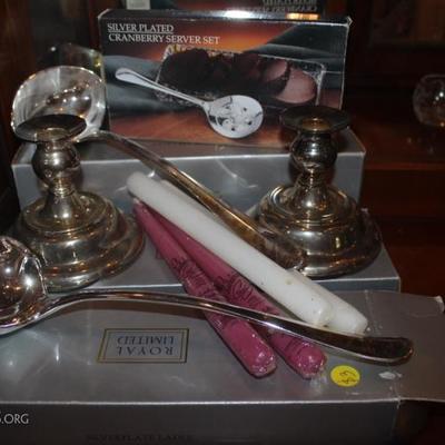 Set of 3 silver plated large ladles, pair of silver plated candlesticks, and silver plated cranberry serving set
