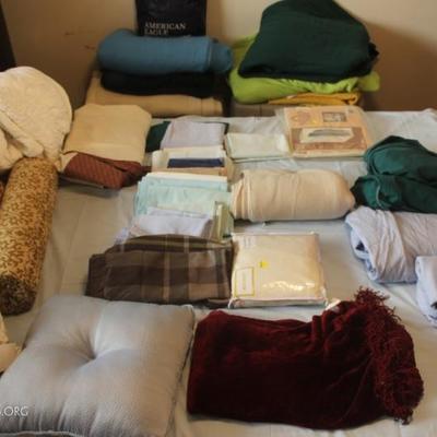 Box lot of bed linens, pillow cases, blankets, pillows
