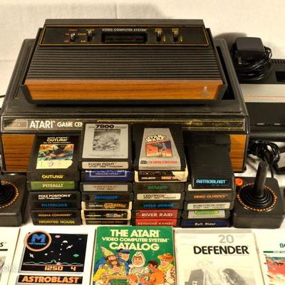 Vintage Atari Systems Lot:  Atari 2600 and 7800 systems with controllers and games.  Complete 2600 system with joysticks, paddles, 26...