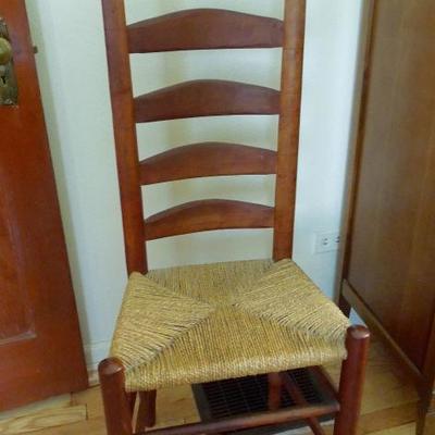 Nice antique ladder back chair with woven cane seat.