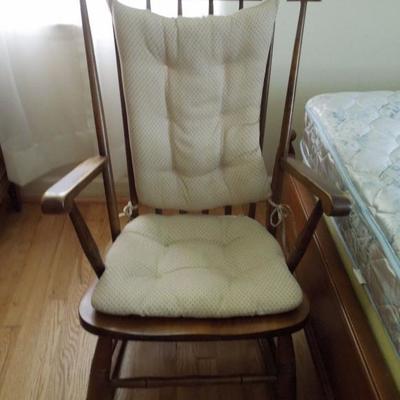 Vintage rocking chair with pads.