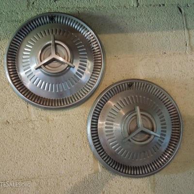Vintage Mercedes Benz hub caps.